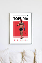 a framed poster of a man with a tattoo, wearing boxing shorts, and holding a boxing glove.
