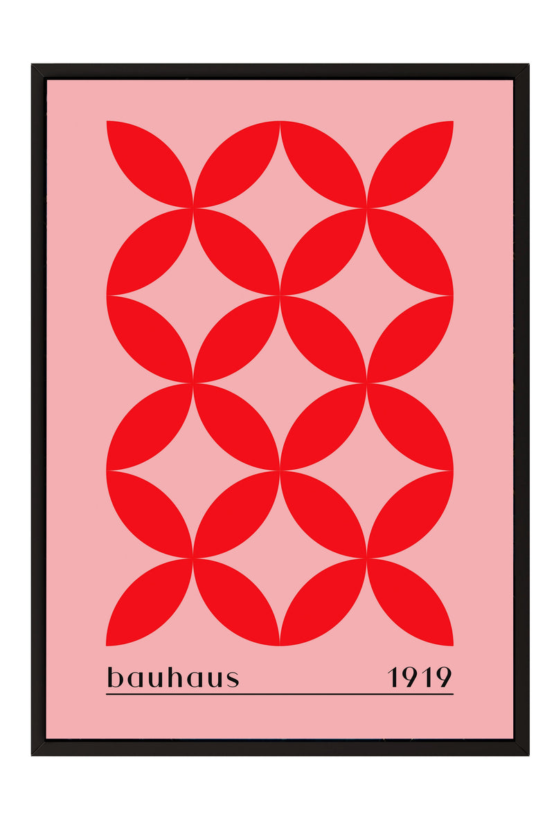 The image is a framed poster featuring a repeating pattern of red circles on a pink background.