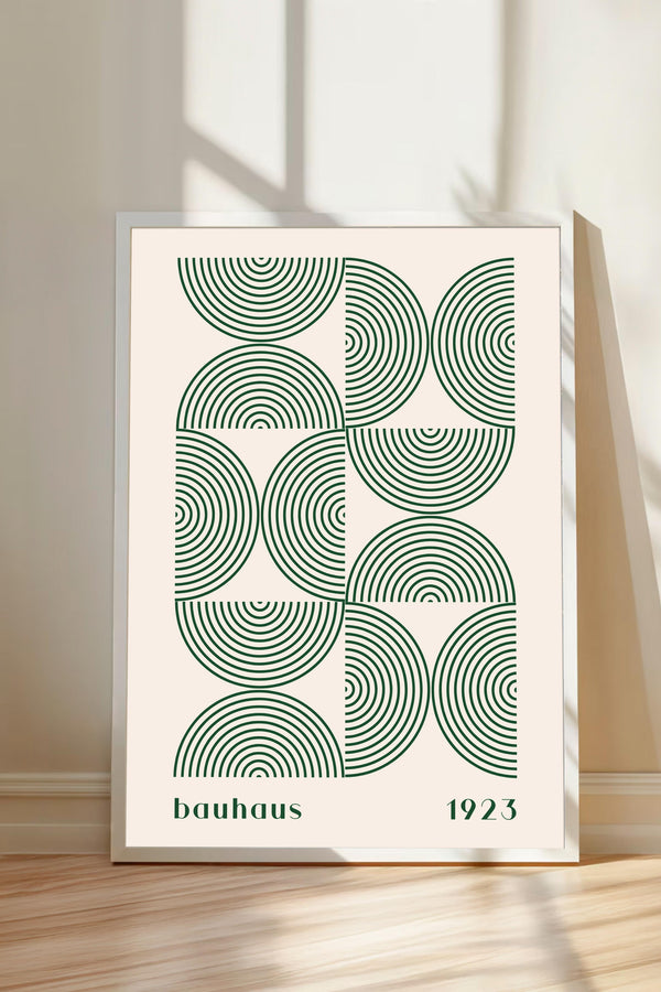 A framed poster with a geometric design featuring concentric circles in shades of green and white.