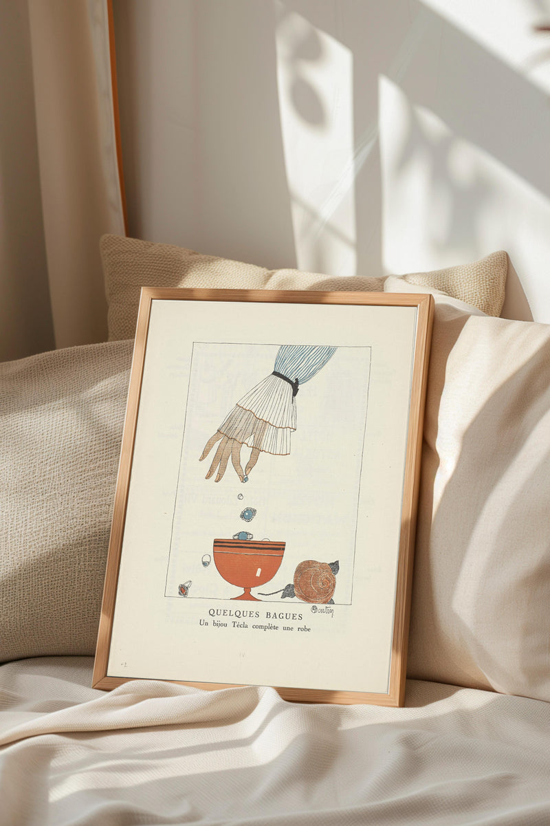 a framed illustration of a hand reaching into a bowl, with a small bird perched on the rim of the bowl.