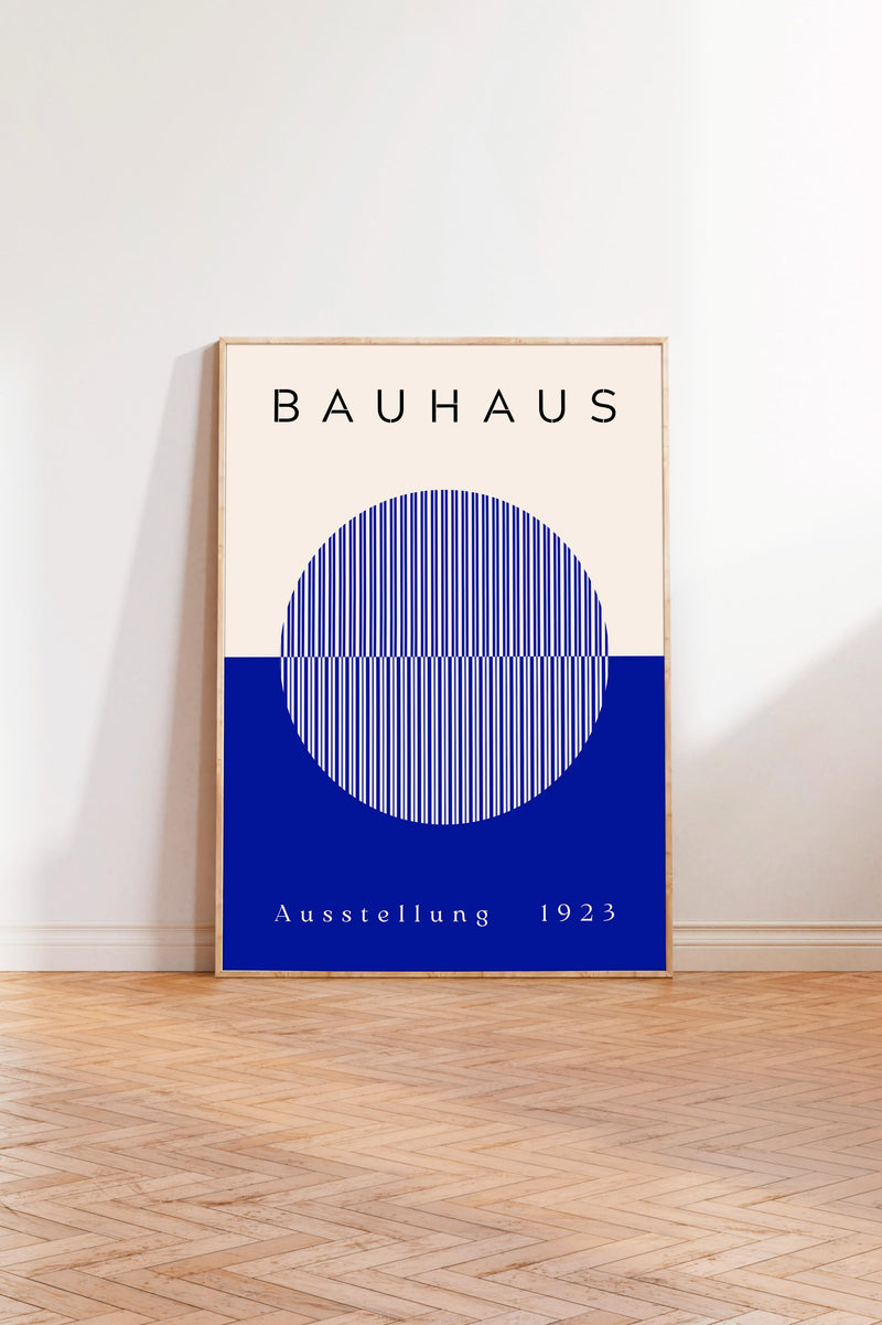 a poster of the Bauhaus art school, with a blue and white color scheme and a circular design element.