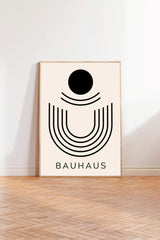 a minimalist art piece with a geometric design and the text "BAHAU" below it.
