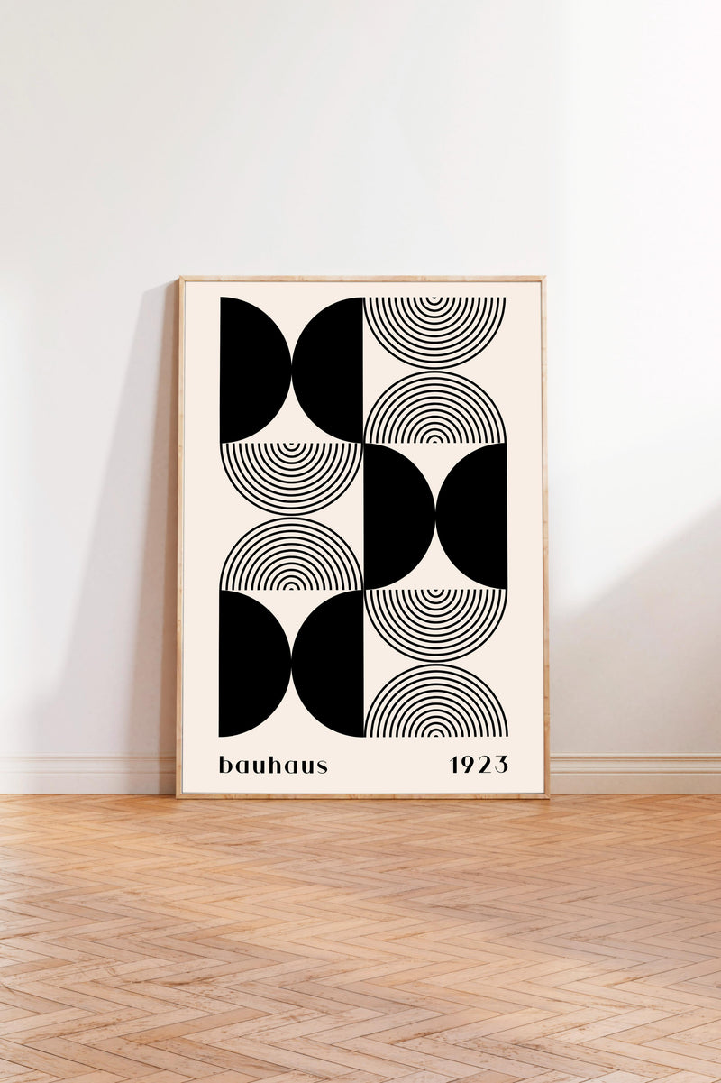 a minimalist art print with a geometric design composed of circles and lines in black and white.