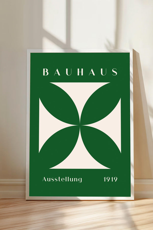 a poster with a large green and white geometric design, and the text "BAHAUX" and "AUSTELLUNG 1919" printed on it.