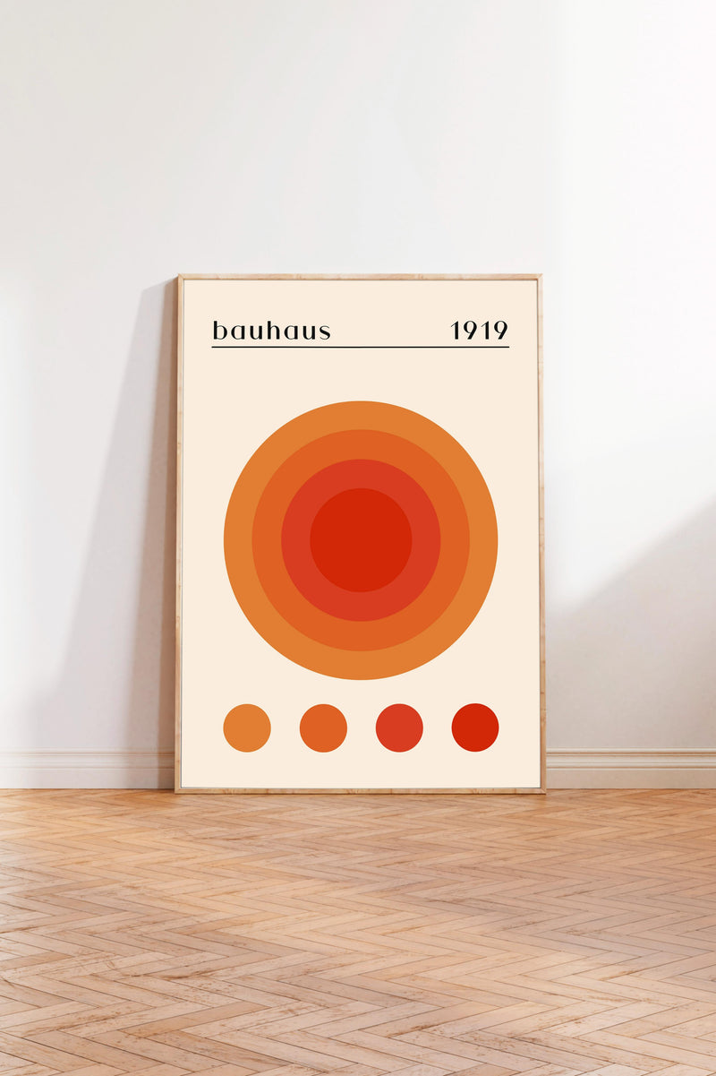 a poster of the Bauhaus school of design from 1919, with a circular design and a gradient of colors.