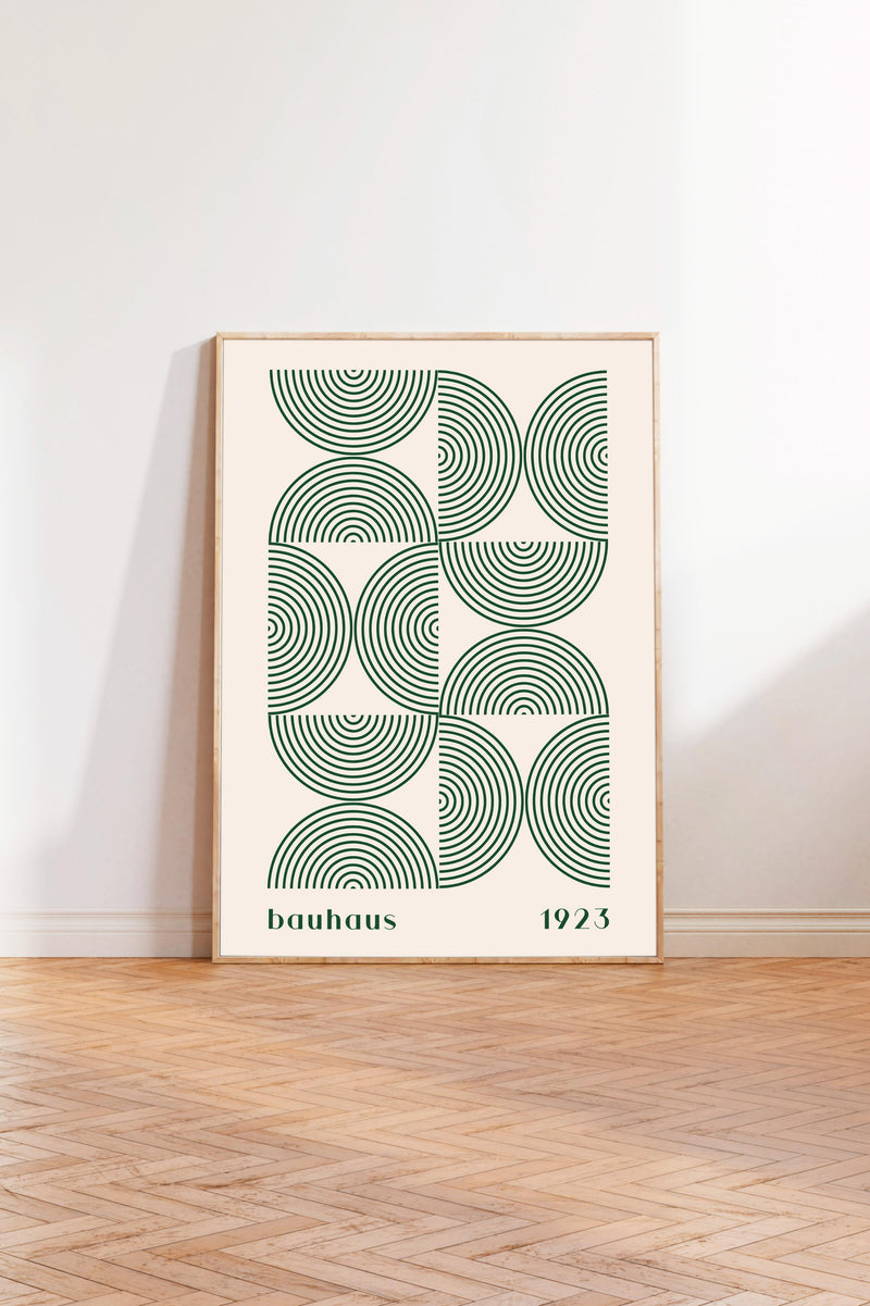 a framed poster with a geometric design in shades of green and white, depicting a pattern of circles and lines.