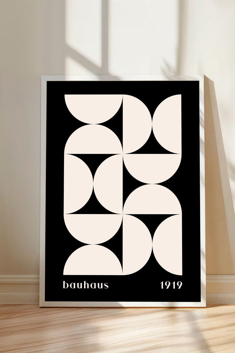 a minimalist black and white poster with a geometric design composed of circles and lines.