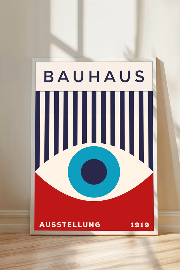 The image is a poster for the Bauhaus art school, featuring a stylized eye design with vertical stripes and a red background.