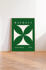 a poster of the Bauhaus art school, with a green and white color scheme and a stylized geometric design.