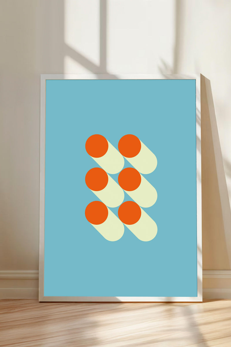 a framed abstract artwork with a blue background and a geometric design composed of overlapping circles in orange and white colors.