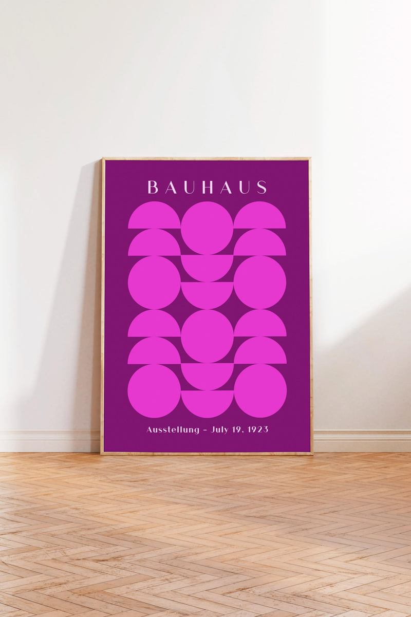 a poster with a bold purple background and a geometric design of circles and ovals. The text on the poster reads "BAHAUX" and "Ausstellung - July 19, 1925".