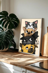 A framed illustration of a group of cartoon-like dogs peeking out from behind each other, with a wooden counter and a potted plant in the background.