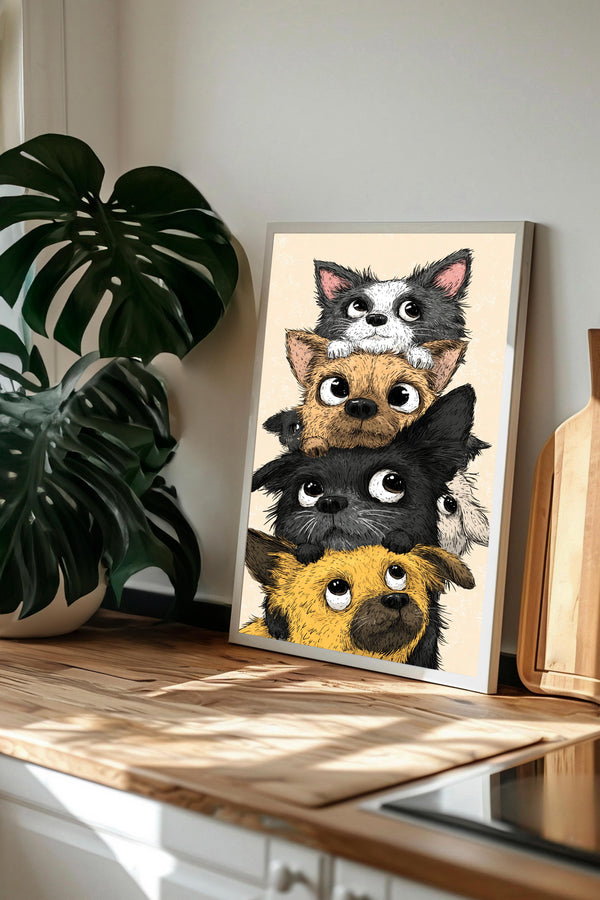 A framed illustration of a group of cartoon-like dogs peeking out from behind each other, with a wooden counter and a potted plant in the background.
