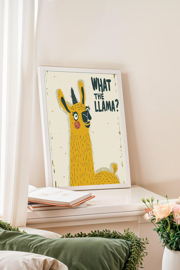 a framed illustration of a yellow llama with the text "WHAT THE LLAMA?" displayed on it.