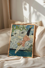a framed vintage advertisement poster with a woman diving into the ocean, surrounded by clouds and palm trees.