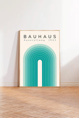 a minimalist poster of Bauhaus, a renowned art school founded in 1933, with a geometric design in shades of blue and green.