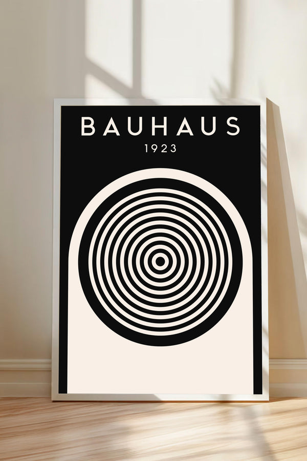 A poster with the text "BAHAUX 1923" and a black and white spiral design on a white background.