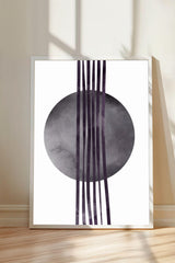 a minimalist art piece with a large circular shape and vertical lines extending from it.