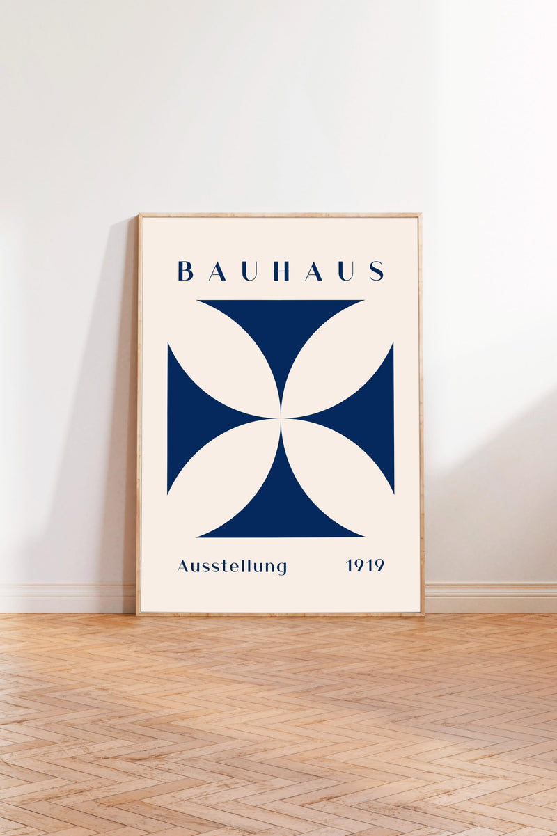 a poster of the Bauhaus art school, with a large blue and white geometric design in the center.