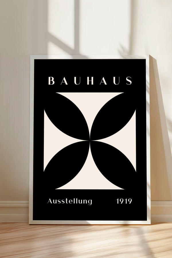 a poster with the text "BAHAUX" and "AUSTSTELLUNG 1919" on it, along with a geometric design in black and white.
