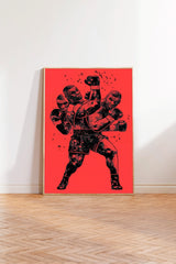 The image is a framed poster depicting a boxing scene with two figures engaged in a fight, set against a red background.
