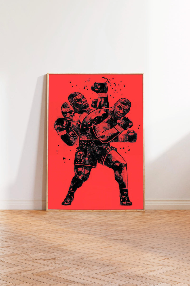 The image is a framed poster depicting a boxing scene with two figures engaged in a fight, set against a red background.