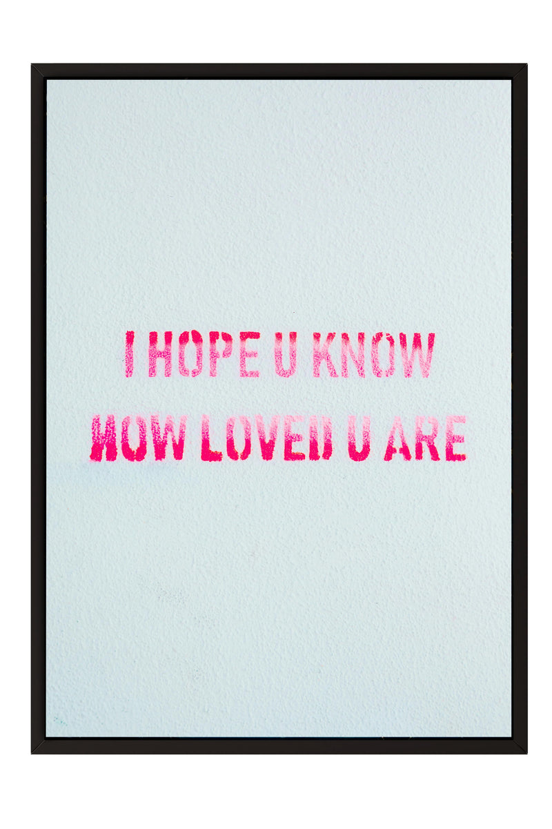 the text "I HOPE U KNOW NOW LOVED U ARE" in a bold, pink font against a light blue background.