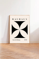 a minimalist poster of the Bauhaus art school, with a geometric design in black and white.