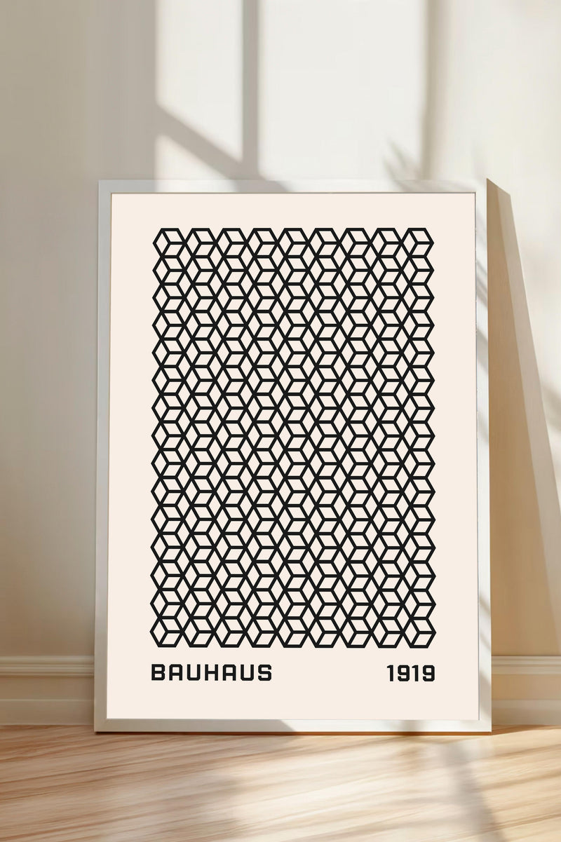 a framed poster with a repeating geometric pattern in black and white.