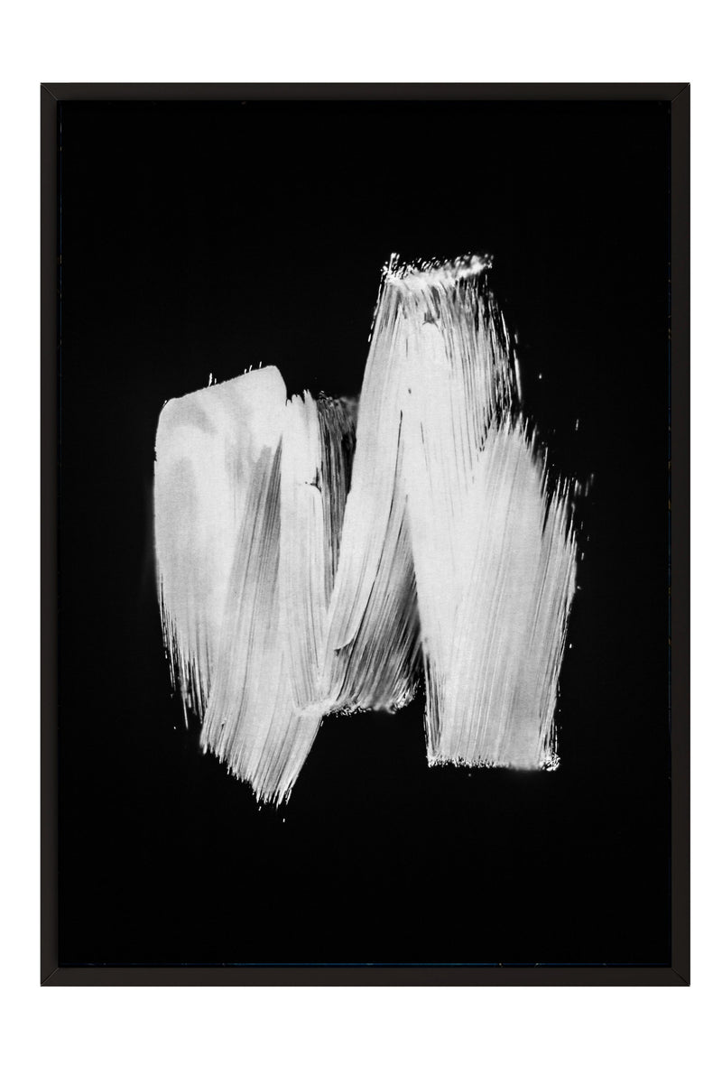 The image is a black and white abstract artwork featuring a brush stroke-like shape against a dark background.