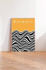 a poster with a bold, abstract design of black and white stripes on a yellow background.