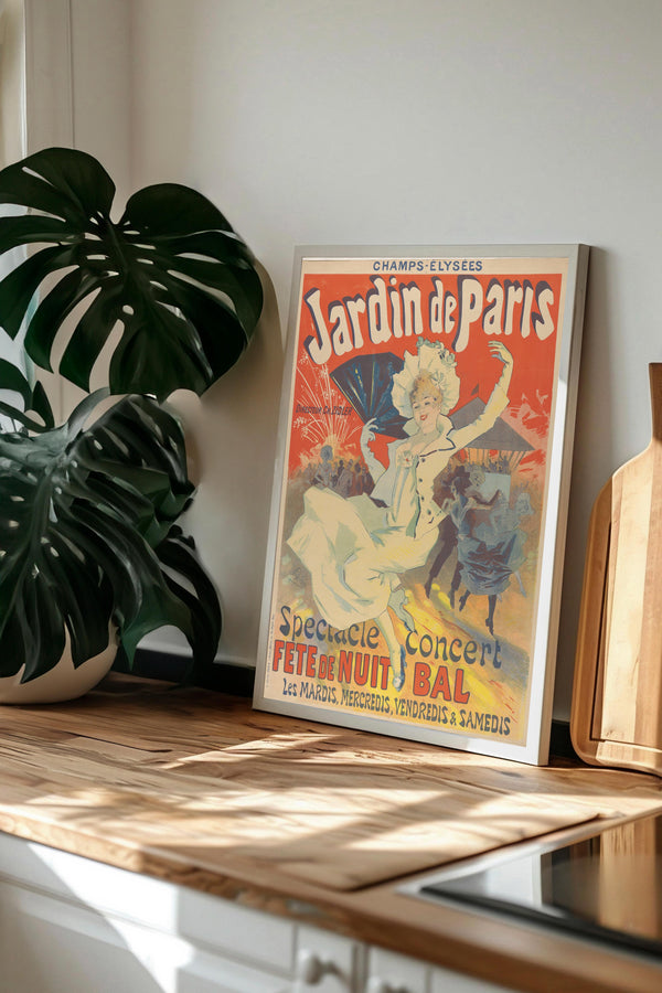 A framed vintage poster of a woman dancing in a garden, with the text "Jardin de Paris" and "Spectacle Concert Fétecune Nocturne Bal".