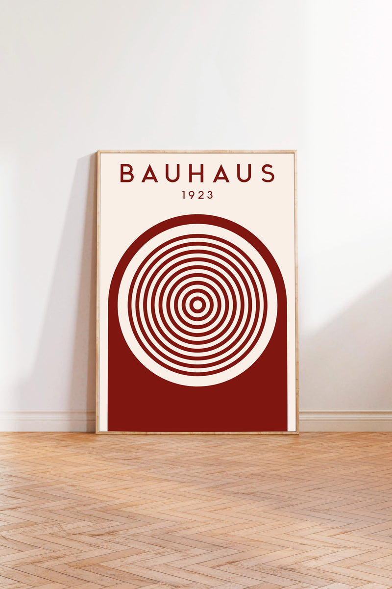 a poster of Bauhaus, a famous art school and architect, with a red and white color scheme and a circular design element.