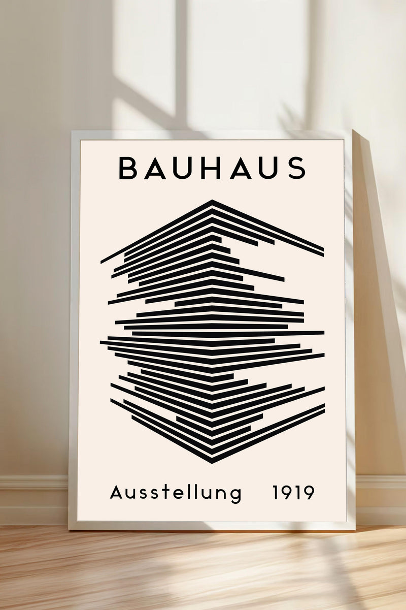 The image is a poster for the Bauhaus art school, featuring a geometric design with lines and shapes in black and white.