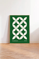 A framed poster with a geometric design in green and white colors, featuring a repeating pattern of white circles on a green background.
