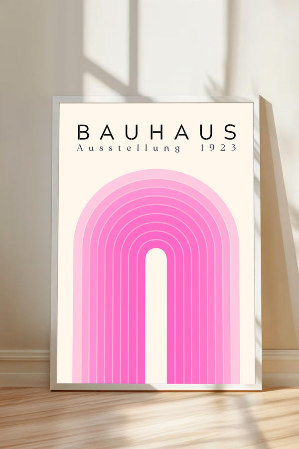 a poster with a pink and white color scheme, depicting a large arch or tunnel-like shape. The text on the poster reads "BAHAUX Ausstellung 1923".