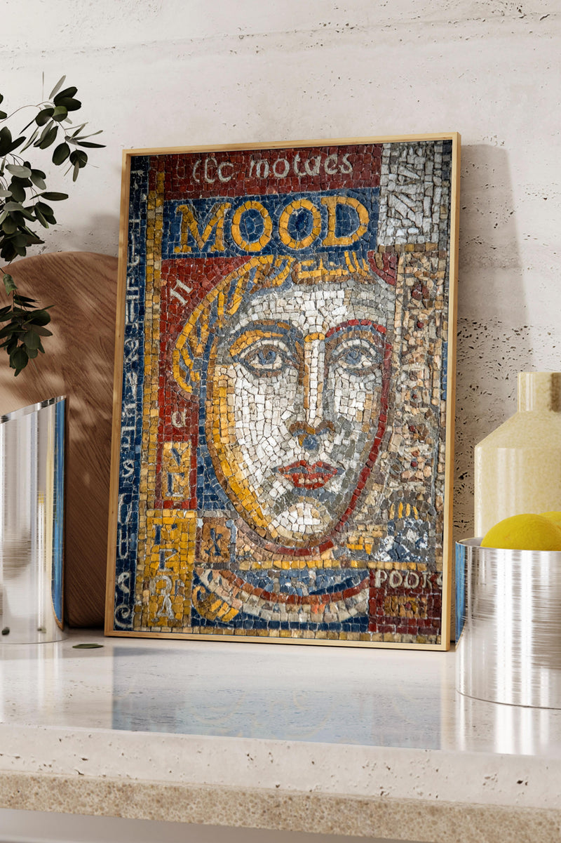 a framed mosaic artwork depicting a woman's face, with the text "Mood" prominently displayed.