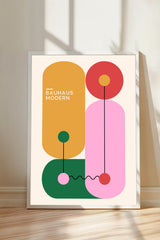 The image is a minimalist art piece featuring abstract geometric shapes in various colors, including orange, pink, green, and yellow, arranged in a modern art style.